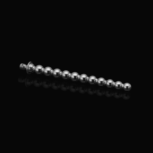 Full horizontal view of a stainless steel beaded urethral sound (Bubbles 11-13 mm) resting on a black reflective surface.